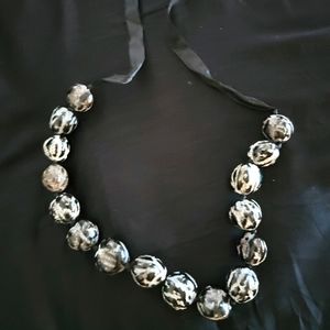 Decorated kukui nut necklace